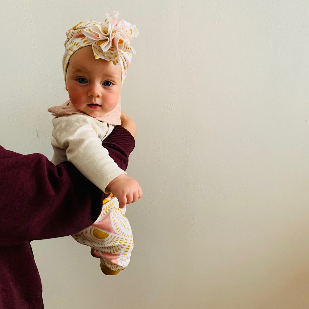 
                      
                        Babyturban Tragebild
                      
                    